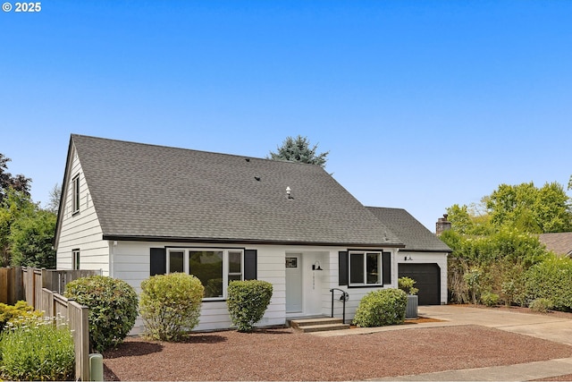 18090 NW Avalon Dr, Portland, OR 97229 - cape cod-style house featuring a garage, concrete driveway, roof with shingles, and a chimney