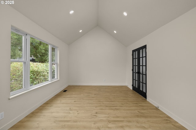 18090 NW Avalon Dr, Portland, OR 97229 - spare room featuring recessed lighting, vaulted ceiling, and light wood-type flooring