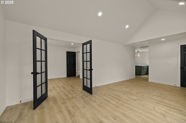 18090 NW Avalon Dr, Portland, OR 97229 - spare room with french doors, recessed lighting, light wood-style floors, a chandelier, and high vaulted ceiling
