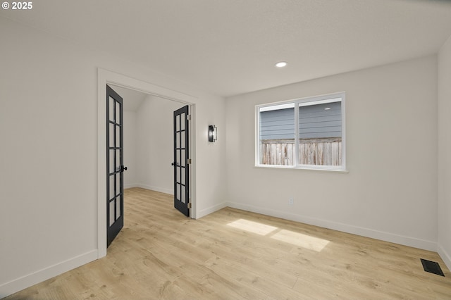 18090 NW Avalon Dr, Portland, OR 97229 - unfurnished room with light wood-style flooring, recessed lighting, and french doors