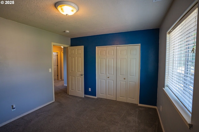 2872 Bluff Ave, Salem, OR 97302 - unfurnished bedroom with multiple windows, carpet flooring, baseboards, and a textured ceiling