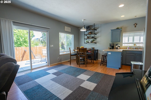2872 Bluff Ave, Salem, OR 97302 - dining area with a textured ceiling, light wood-style flooring, recessed lighting, and baseboards