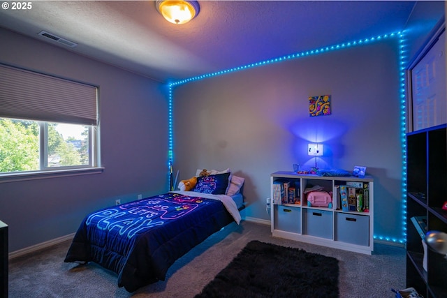2872 Bluff Ave, Salem, OR 97302 - carpeted bedroom featuring a textured ceiling and baseboards