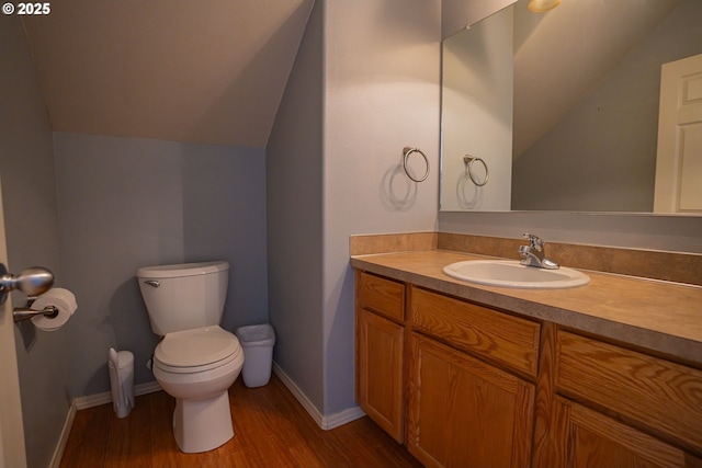 2872 Bluff Ave, Salem, OR 97302 - bathroom featuring toilet, wood finished floors, vanity, lofted ceiling, and baseboards