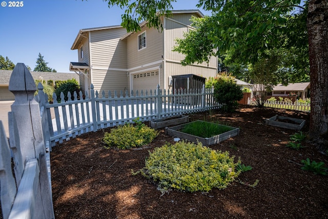 2872 Bluff Ave, Salem, OR 97302 - view of front of home featuring a garage, driveway, and a garden
