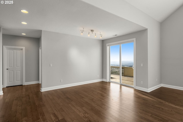 unfurnished room featuring dark wood-style floors, recessed lighting, and baseboards