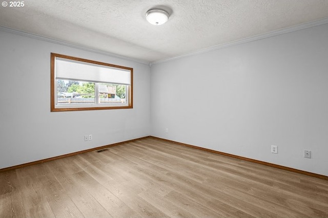 5270 Faircrest Ct SE, Salem, OR 97306 - empty room with light wood-type flooring, baseboards, ornamental molding, and a textured ceiling