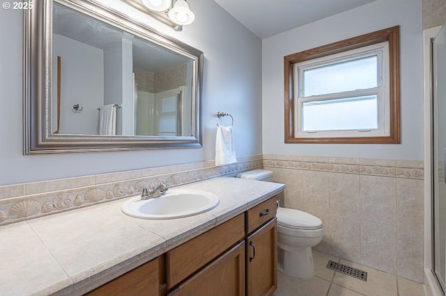 5270 Faircrest Ct SE, Salem, OR 97306 - full bath featuring tile walls, vanity, visible vents, tile patterned floors, and an enclosed shower