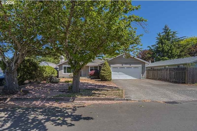 5270 Faircrest Ct SE, Salem, OR 97306 - view of front of home featuring an attached garage, driveway, and fence