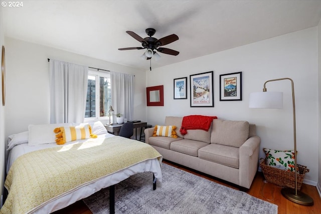 bedroom featuring hardwood / wood-style flooring and ceiling fan