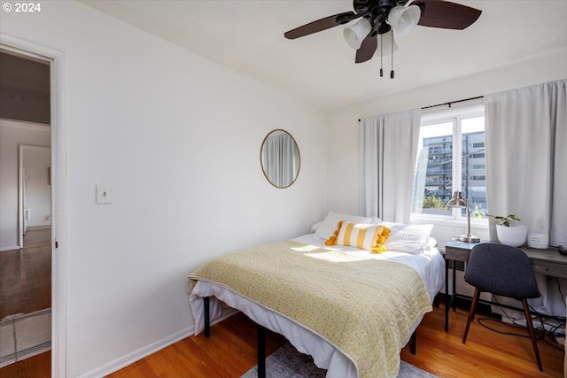 bedroom featuring ceiling fan and hardwood / wood-style floors