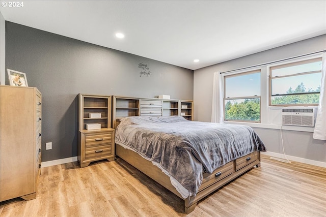 bedroom featuring light hardwood / wood-style flooring and cooling unit