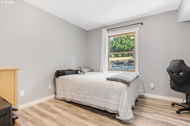 bedroom featuring hardwood / wood-style flooring