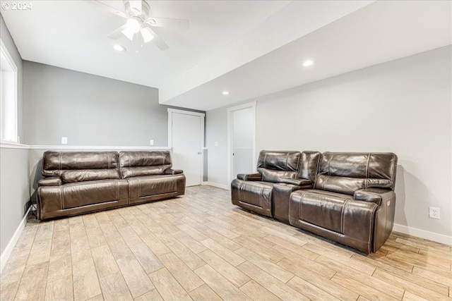 living room featuring ceiling fan and light wood-type flooring