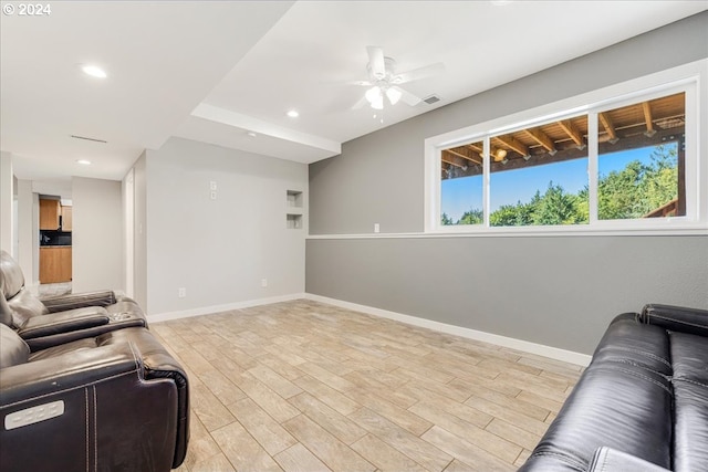 living room with ceiling fan and light hardwood / wood-style floors