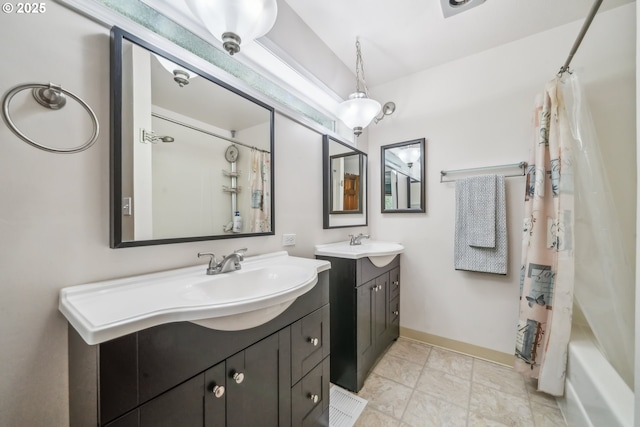 17476 SW Edy Rd, Sherwood, OR 97140 - full bathroom featuring two vanities, baseboards, and shower / tub combo