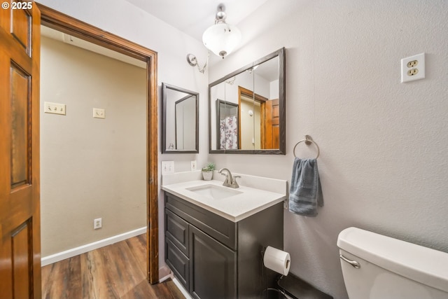 17476 SW Edy Rd, Sherwood, OR 97140 - bathroom featuring vanity, wood finished floors, toilet, and baseboards