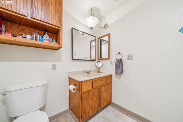 17476 SW Edy Rd, Sherwood, OR 97140 - bathroom with toilet, vanity, baseboards, and tile patterned floors