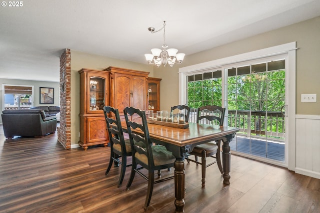 17476 SW Edy Rd, Sherwood, OR 97140 - dining room featuring a chandelier, dark wood-type flooring, and a wainscoted wall