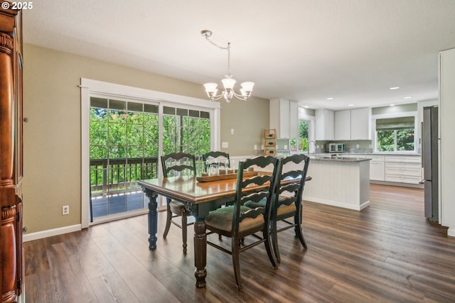 17476 SW Edy Rd, Sherwood, OR 97140 - dining space with a chandelier, dark wood-style flooring, recessed lighting, and baseboards