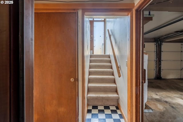 stairway featuring tile patterned floors