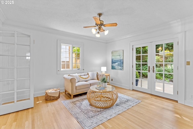 7311 SE 31st Ave, Portland, OR 97202 - living area featuring french doors, crown molding, wood finished floors, a textured ceiling, and ceiling fan