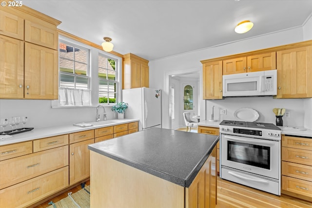 7311 SE 31st Ave, Portland, OR 97202 - kitchen with white appliances, light brown cabinets, a kitchen island, and light wood finished floors