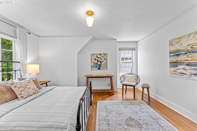 7311 SE 31st Ave, Portland, OR 97202 - bedroom featuring ornamental molding, a textured ceiling, and wood finished floors
