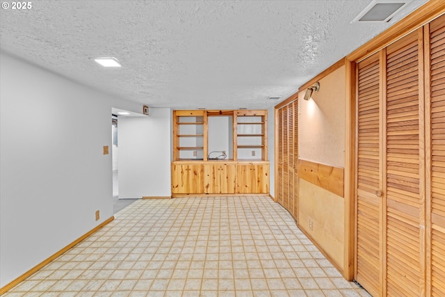 7311 SE 31st Ave, Portland, OR 97202 - spare room with a textured ceiling and wooden walls