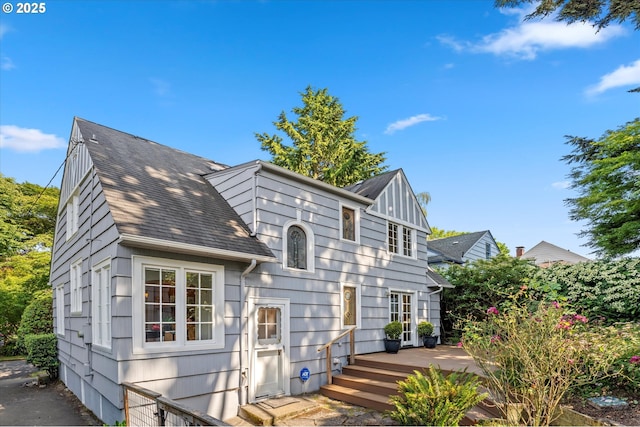 7311 SE 31st Ave, Portland, OR 97202 - view of front facade with a wooden deck and a shingled roof