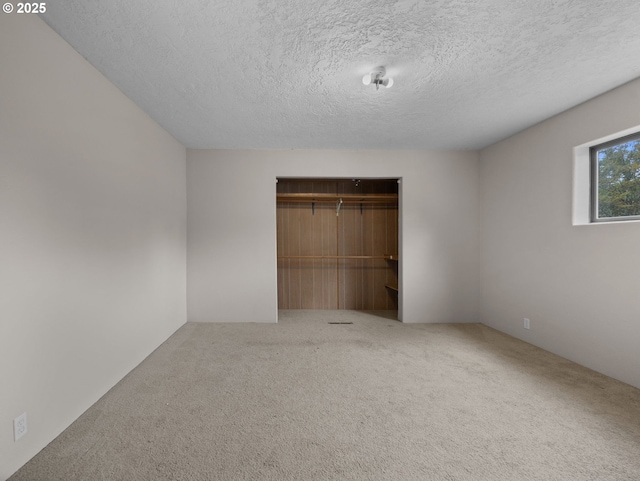 5327 SE Ogden St, Portland, OR 97206 - unfurnished bedroom featuring a textured ceiling, carpet, and a closet