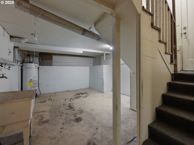 5327 SE Ogden St, Portland, OR 97206 - unfinished basement featuring stairs and water heater
