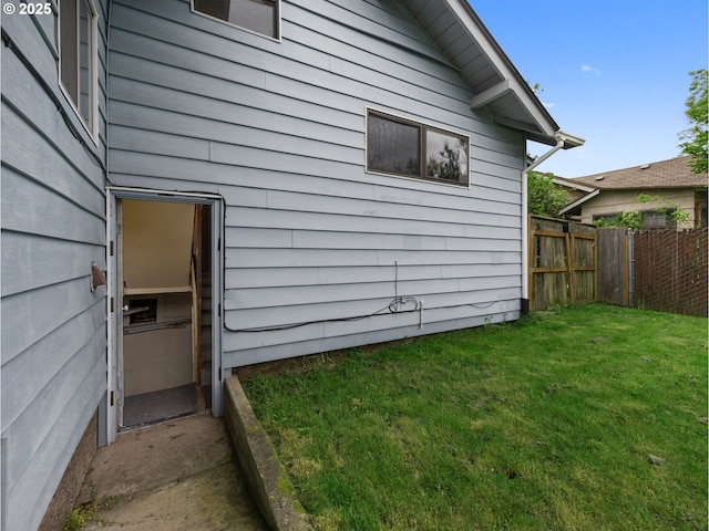 5327 SE Ogden St, Portland, OR 97206 - view of property exterior with a lawn and fence