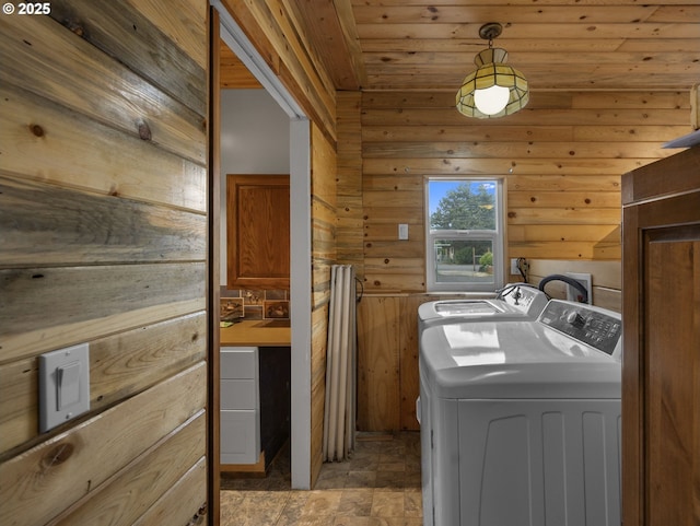 5327 SE Ogden St, Portland, OR 97206 - washroom featuring stone finish floor, laundry area, washing machine and dryer, wood walls, and wooden ceiling