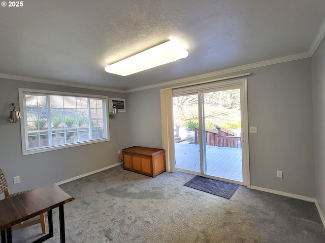 entryway with a wall mounted air conditioner, crown molding, a textured ceiling, and carpet