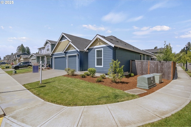 view of front of house with concrete driveway, a garage, and a residential view