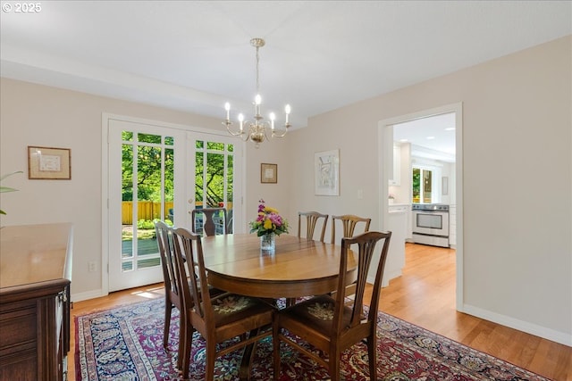 2308 Summit Dr, Lake Oswego, OR 97034 - dining room featuring a chandelier, french doors, and light wood-style flooring