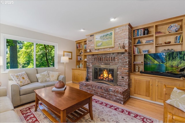 2308 Summit Dr, Lake Oswego, OR 97034 - living room featuring a brick fireplace and light wood-style flooring