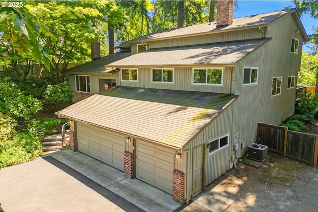 2308 Summit Dr, Lake Oswego, OR 97034 - back of property with a chimney, a shingled roof, and driveway