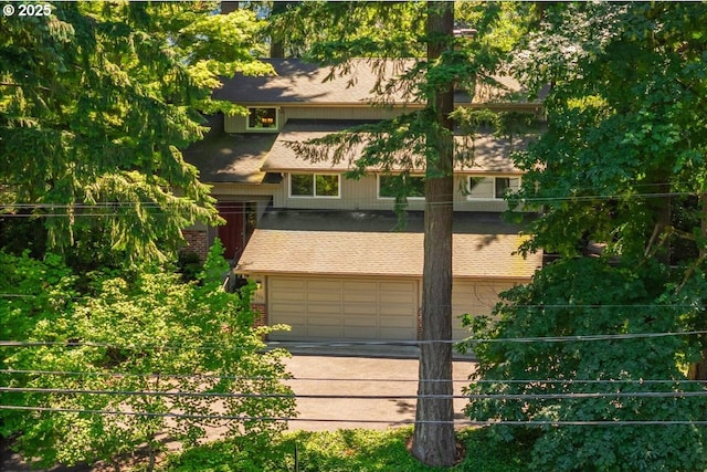 2308 Summit Dr, Lake Oswego, OR 97034 - view of front facade featuring a garage, concrete driveway, and brick siding