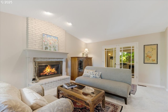 2308 Summit Dr, Lake Oswego, OR 97034 - living area featuring lofted ceiling, a fireplace, french doors, and carpet floors