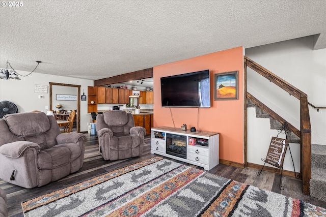7896 State Highway 38, Drain, OR 97435 - living area featuring wood finished floors, a textured ceiling, and stairway
