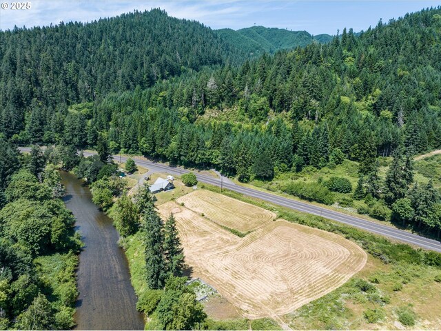 7896 State Highway 38, Drain, OR 97435 - aerial view of property and surrounding area with a forest and a mountain backdrop