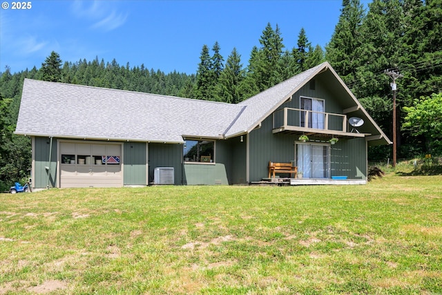 7896 State Highway 38, Drain, OR 97435 - back of property with a shingled roof, a lawn, a balcony, and a view of trees