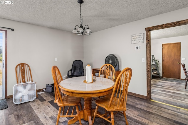 7896 State Highway 38, Drain, OR 97435 - dining area with a textured ceiling, wood finished floors, and a chandelier