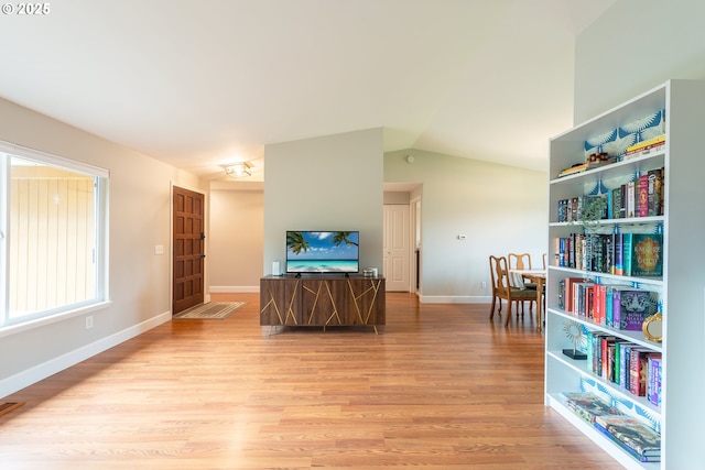 1919 SE 22nd Pl, Renton, WA 98055 - living area with light wood-style floors, vaulted ceiling, and baseboards