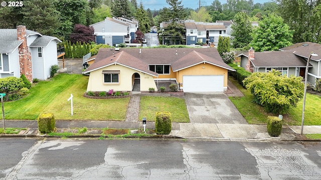 1919 SE 22nd Pl, Renton, WA 98055 - view of front of house featuring driveway, a front lawn, an attached garage, a residential view, and stucco siding
