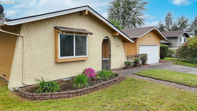 1919 SE 22nd Pl, Renton, WA 98055 - view of front of house with asphalt driveway, a garage, stucco siding, and a front lawn