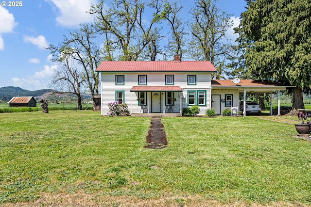 81052 Davisson Rd, Creswell, OR 97426 - view of front of house with a chimney, metal roof, a front yard, and a carport