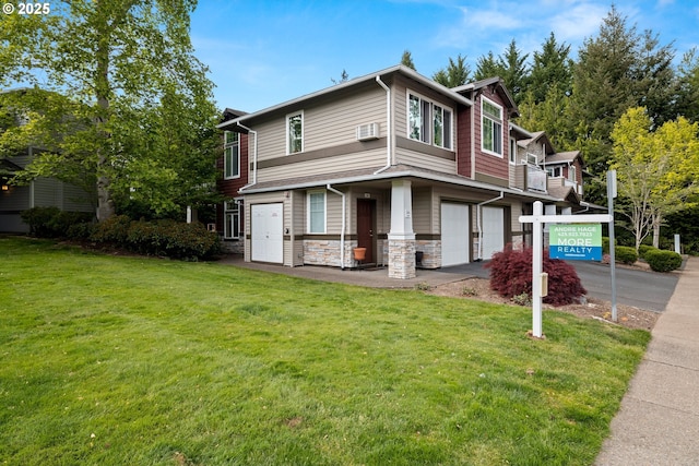 view of front of house featuring driveway, an attached garage, a front lawn, and stone siding